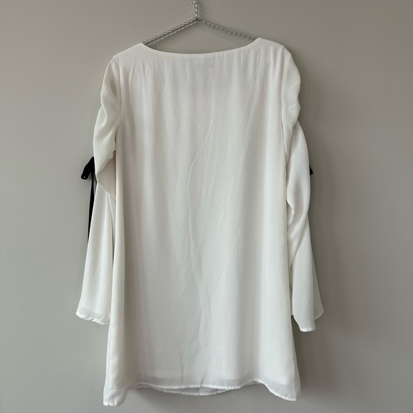 Lulu’s Cherish White Long Sleeve Shift Dress With Black Bow Detail. - Picture 7 of 9